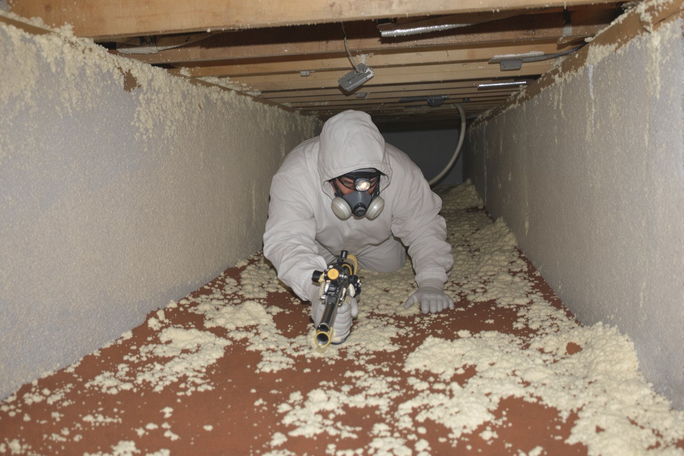 Spray foam insulation being applied to an attic space in a Tulsa home